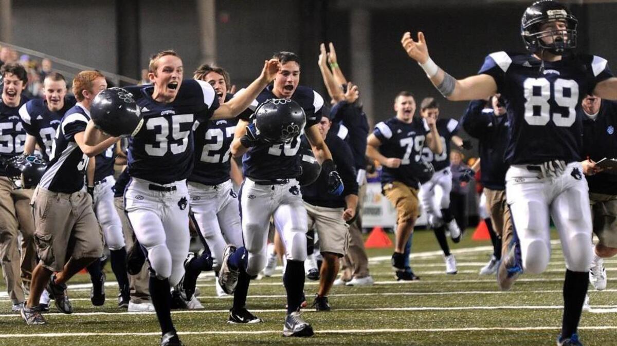 Players from Cascade Christian High School of Puyallup celebrate their triple-overtime state semifinals win over Montesano at the Tacoma Dome in 2011. Moments like these will be fewer at the Dome, as the semifinals are leaving after 32 years.