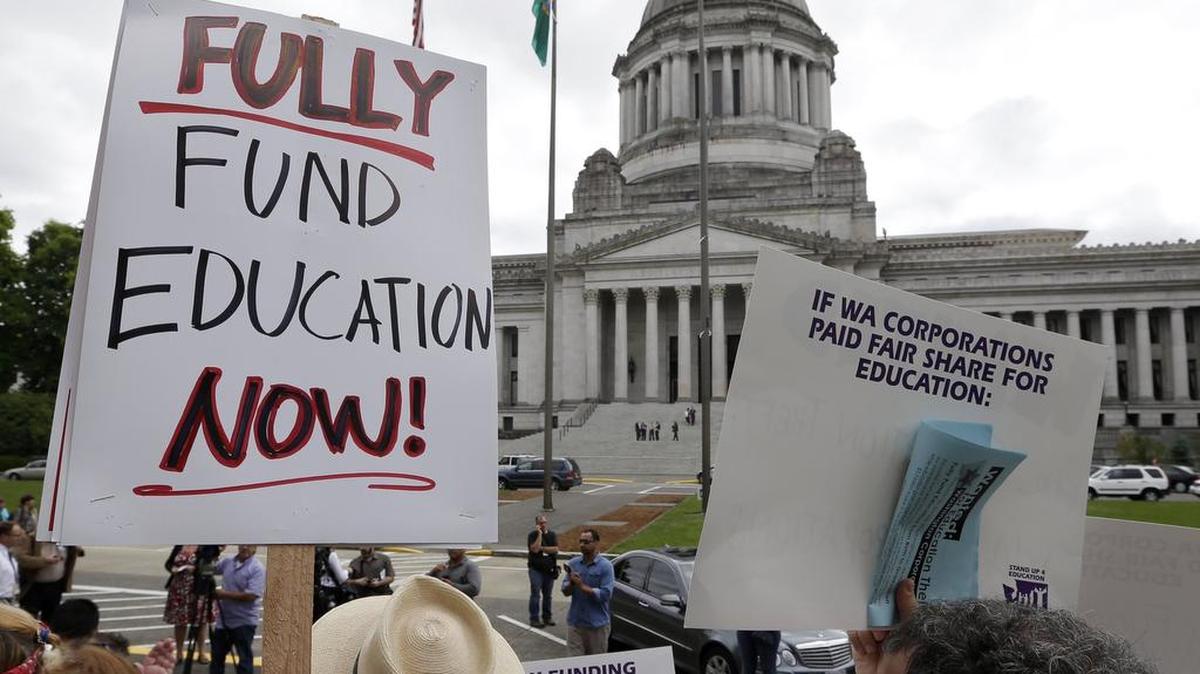 
Demonstrators in Olympia advocate for more state spending on education in September 2014.
