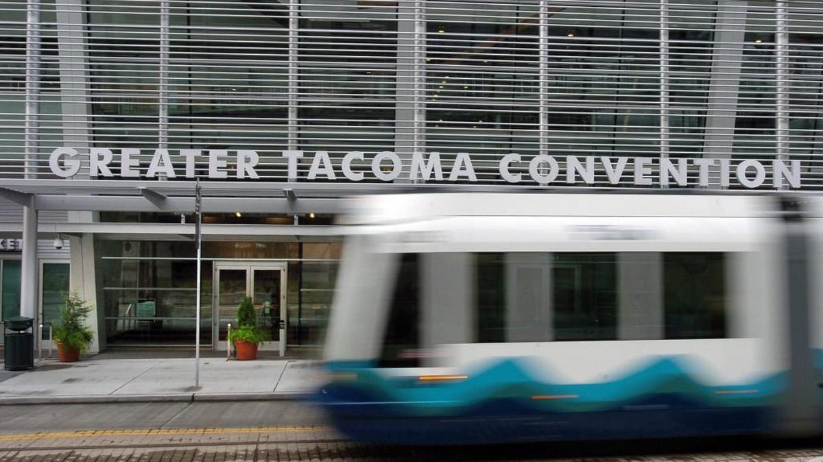 The Sound Transit Link light rail shuttle passes by the front doors of the Greater Tacoma Convention & Trade Center, where some events now can be held under new COVID-19 rules.