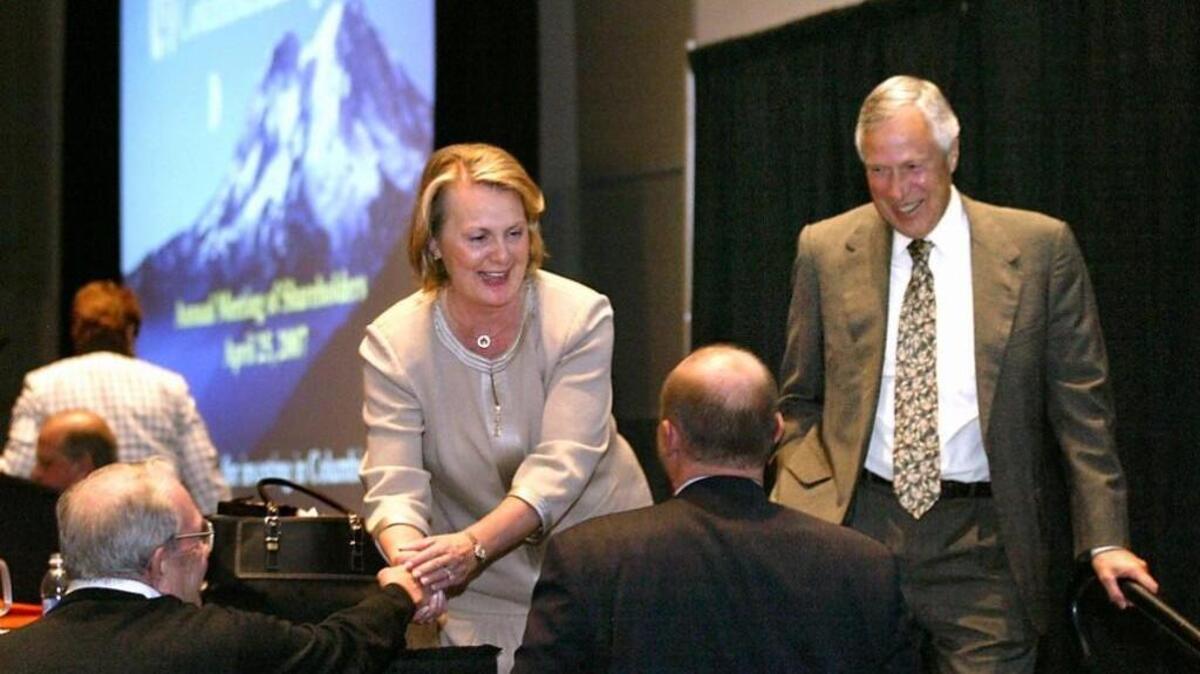 Columbia Bank CEO Melanie Dressel and board chairman William Weyerhaeuser greet shareholders and guests at an annual company meeting at the Tacoma Convention & Trade Center. Dressel died in February at age 64.