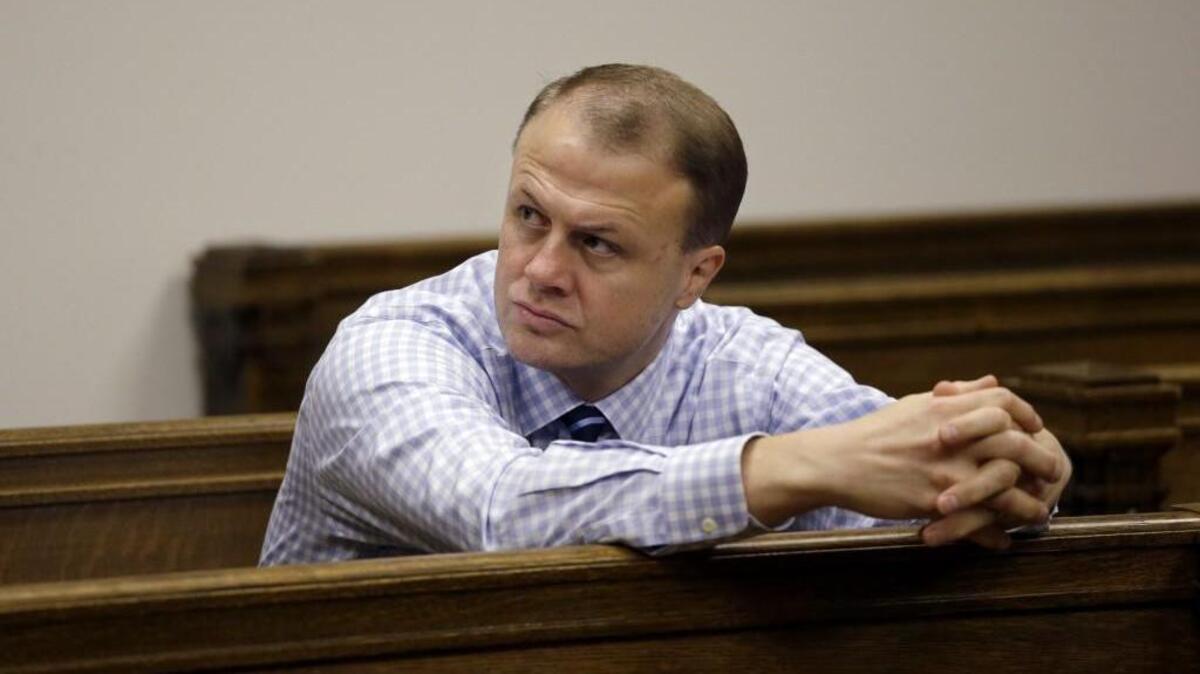 Tim Eyman looks on from the gallery during a King County hearing on the anti-tax measure he was trying to salvage last year. Eyman has moved on to new battles, including collecting signatures for a $30 car-tabs initiative and a court fight over ballot language for three new state taxes.