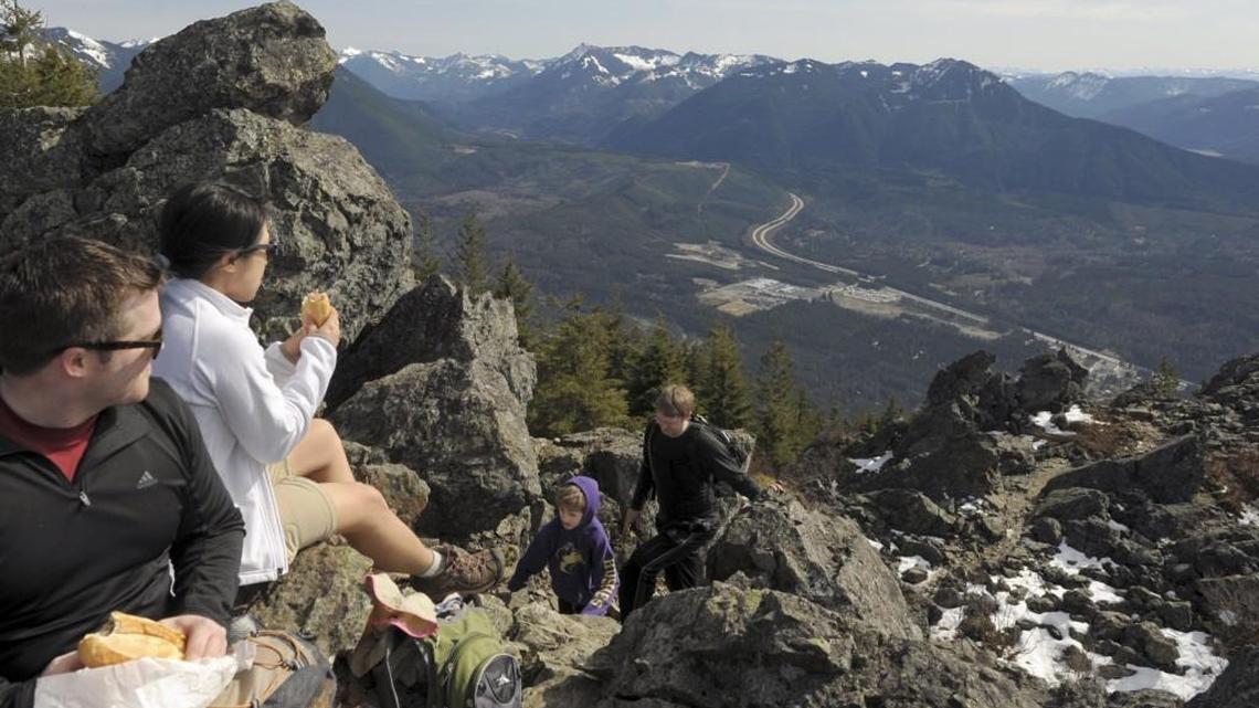 A pair of hikers have lunch near the top of Mt. Si. The four-mile, 3,000-vertical-foot hike near North Bend is a popular one, even mid-week. During the summer, King County now operates bus service to Mount Si and other trailheads in the area. Pierce County doesn’t do anything comparable.