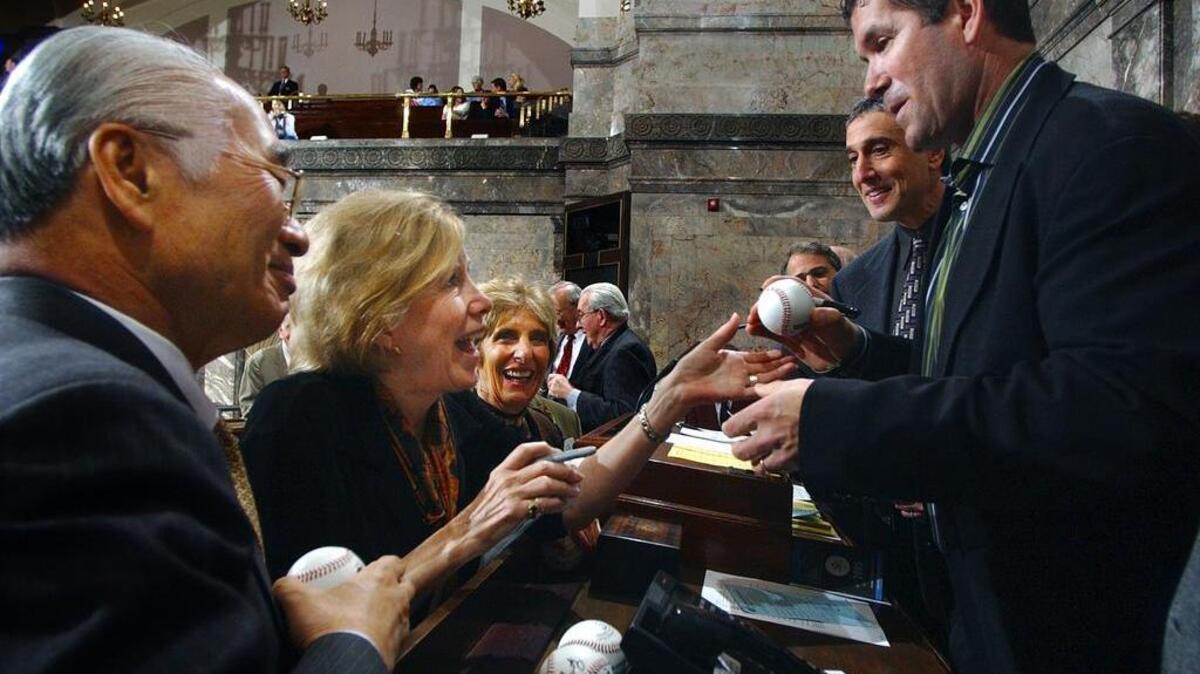 Do the perks of being a state legislator ever end? In Olympia Monday, retired Seattle Mariners designated hitter Edgar Martinez (right) is swarmed by starstruck fans including (from left) Senators Paul Shin, D-Mukilteo, Sen. Jeanne Kohl-Welles, D-Seattle, and Rosemary McAuliffe, D-Bothell.