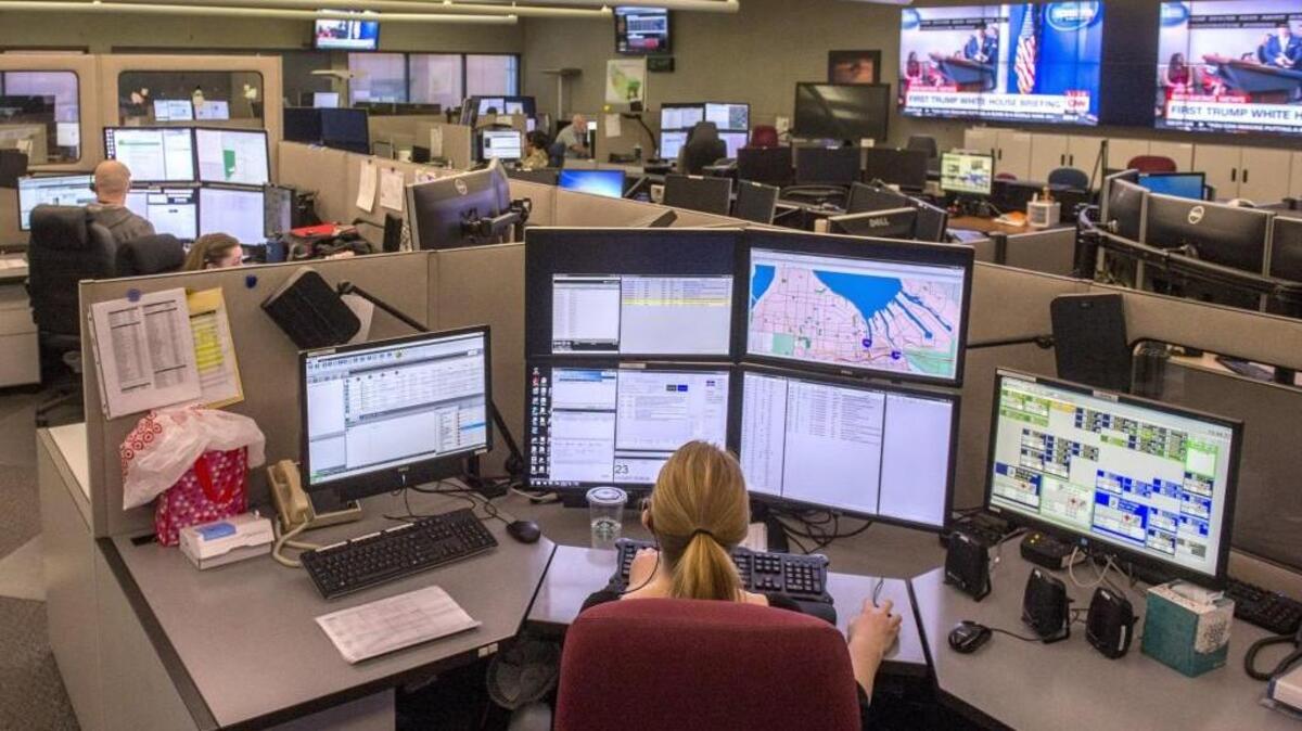 Kris Woodrow, dispatcher for Sound Sound 911, is surrounded by the various screens and tools of her trade while at work in January.