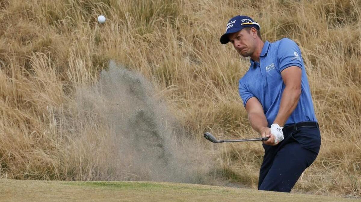 Swedish golfer Henrik Stenson hits out of the bunker on the sixth hole during the first round of the U.S. Open golf championship at Chambers Bay in 2015. Stenson turned heads that year for his criticism of the putting surface at the University Place golf course, saying it was like playing on broccoli.
