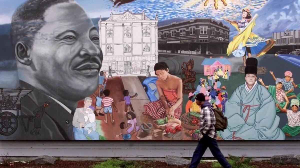 Artist Bob Henry’s multi-cultural mural brightens up a gray day in Tacoma’s Hilltop neighborhood. The mural is across from People’s Park on Martin Luther King Jr. Way.
