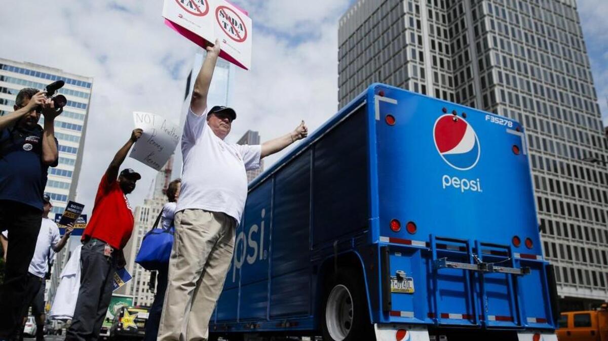 Opponents of a proposed sugary drink tax demonstrate outside City Hall in Philadelphia earlier this month. Philadelphia is set to become the first major American city with a soda tax despite a multimillion-dollar campaign by the beverage industry to block it.