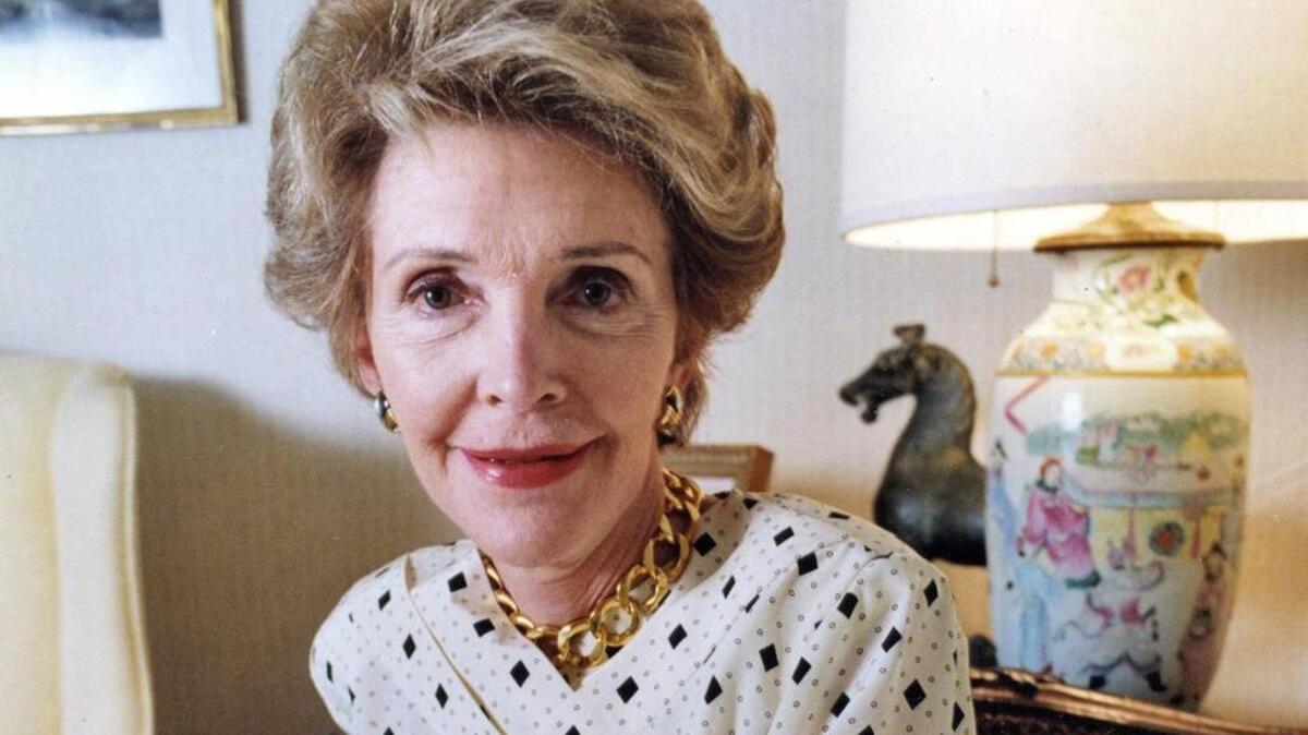 Former first lady Nancy Reagan, seen in 1989 at her office in Los Angeles, died on Sunday at 94.