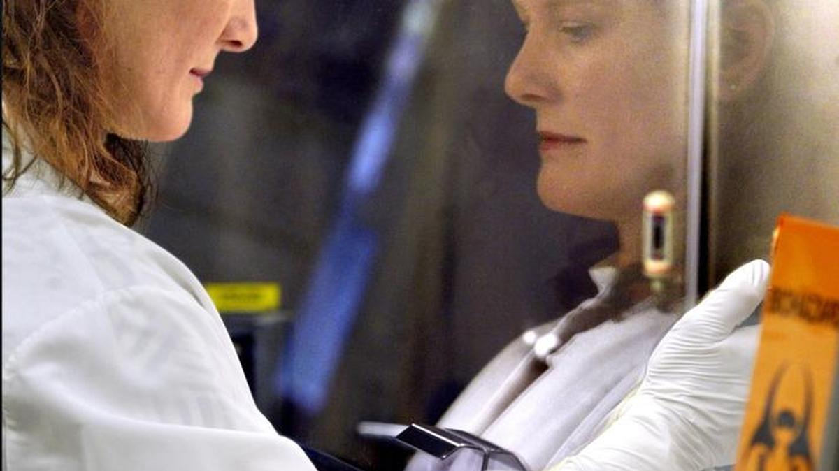 At the Washington State Department of Health laboratories in Shoreline, Kaye Eckmann, lead microbiologist for the molecular lab, prepares samples from across the state to determine if patients have the H1N1 (Swine Flu) virus. 2009