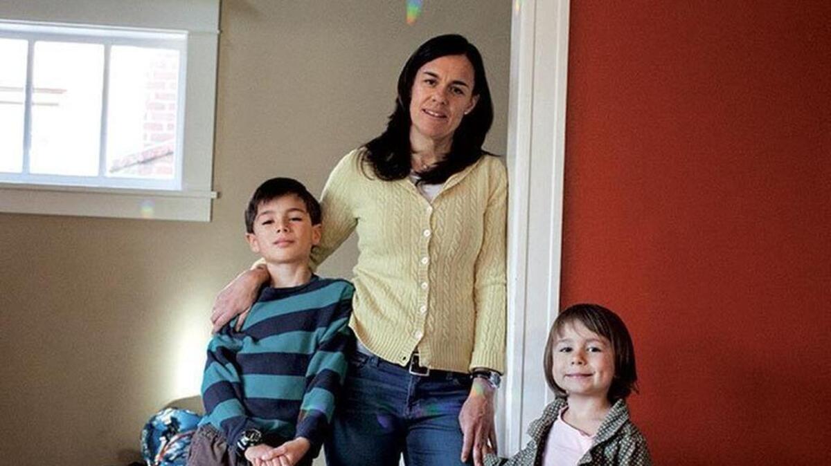 After Jennifer Stuber’s husband killed himself in 2010, she worked with a variety of individuals and groups – including gun rights advocates – to get more suicide prevention tools in place. Here she is seen in 2014 with children Jake, left, and Zoe.