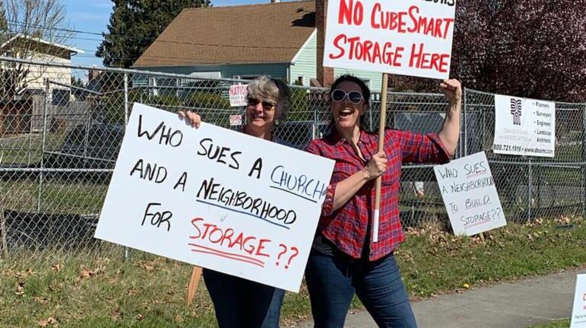Shannon Curtis (left) and Susan Pierce are two Central Tacoma residents who regularly protest a large storage-unit development planned for their neighborhood.