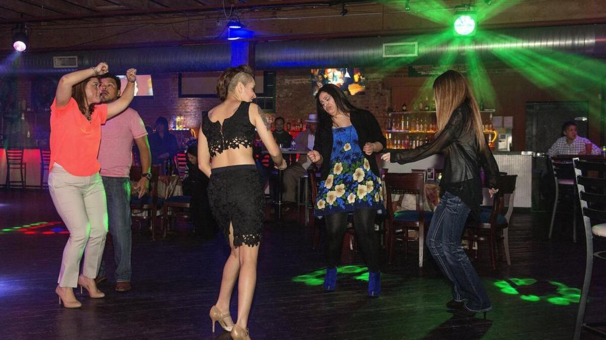 Patrons dance to live music at a Tacoma nightclub in April 2015.