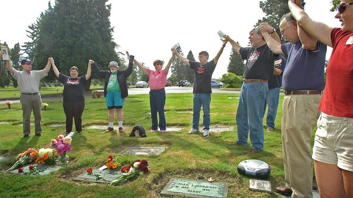 
People gather around the grave site of Ralph Chaplin and his wife Edith in 2007 to celebrate his life during the Ralph Chaplin Labor Day Memorial Service at Calvary Cemetery in Tacoma.
