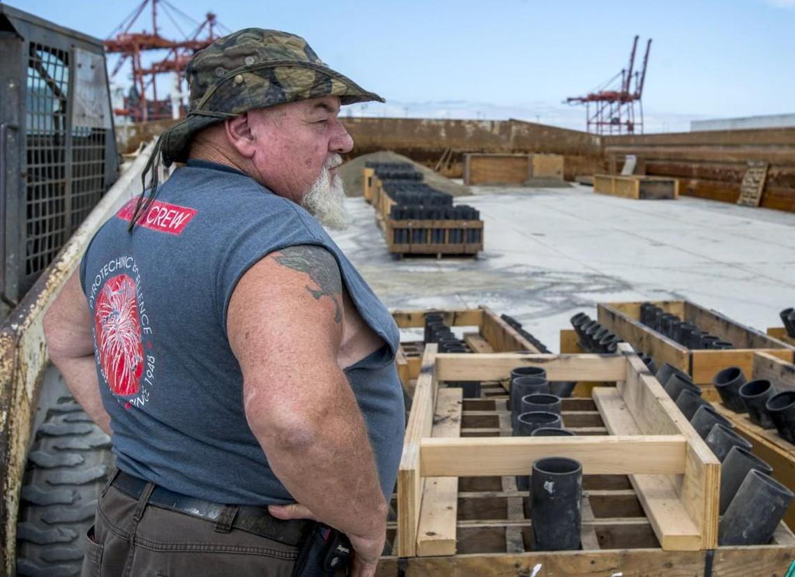 Do not try this at home. Pyrotechnician Gary Louderback surveys his palletized mortars on a barge in Seattle. He led the crew that designed and performed the fireworks show at Tacoma Freedom Fair in 2014. Professional shows like Freedom Fair are the best way to enjoy July 4, as even legal fireworks shot off from your home driveway come with inherent dangers.
