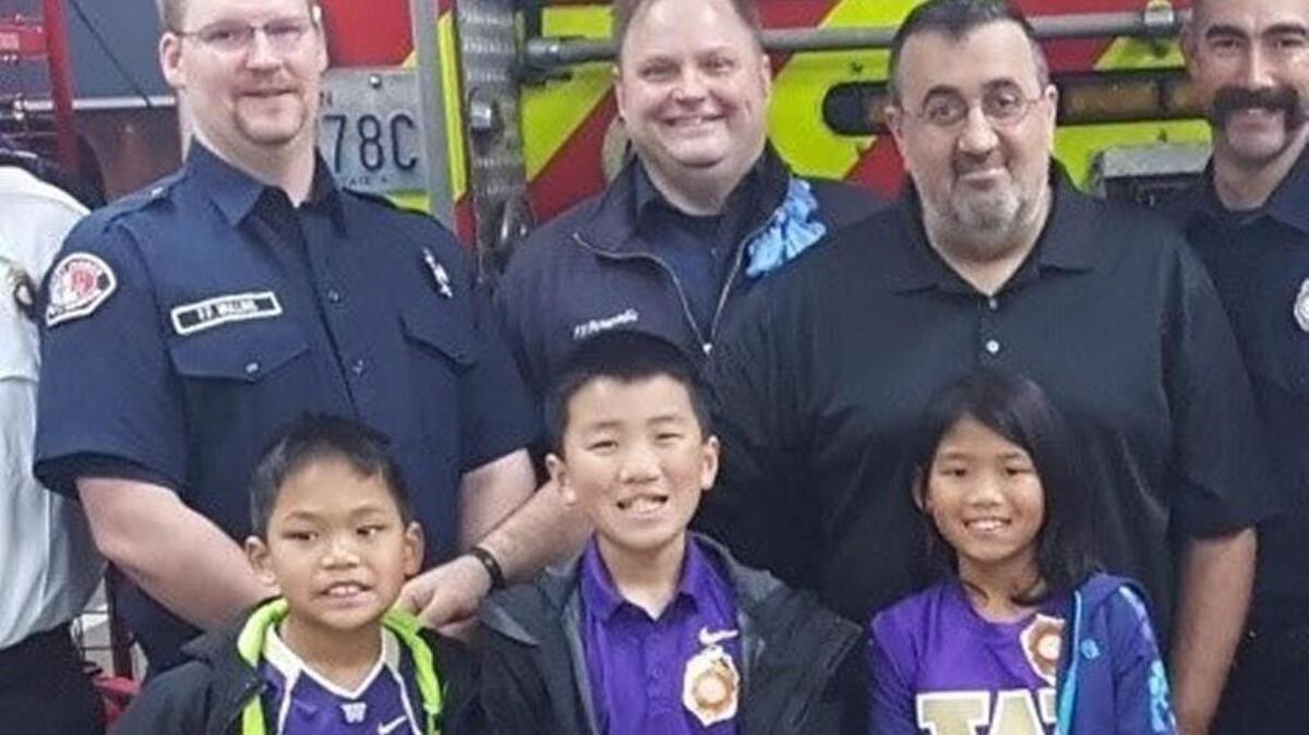 How young is too young to save a life? The Tatarian children of Bonney Lake - Samuel, Isaia and Satapat - are all 10 or younger, but they recently helped perform life-saving CPR on their father, Jack (second from right).