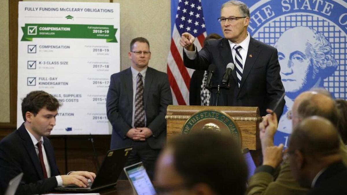 Washington Gov. Jay Inslee takes questions from reporters last week after unveiling his supplemental budget proposal at the Capitol in Olympia.
