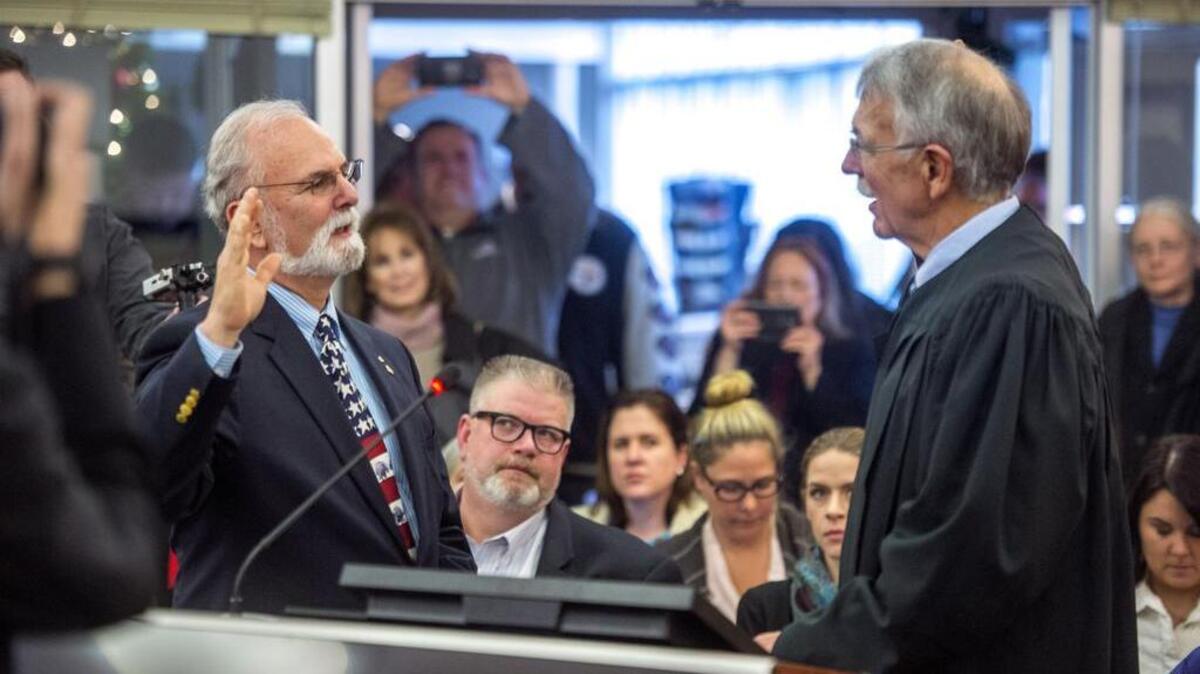 Washington Sen. Phil Fortunato, R-Auburn, shown here taking the oath of office in 2017, stands for all that’s good and true, which is obvious from his choice of necktie. That includes his 2019 legislative proposal to change the name of the Department of Revenue to the Department of Taxation.