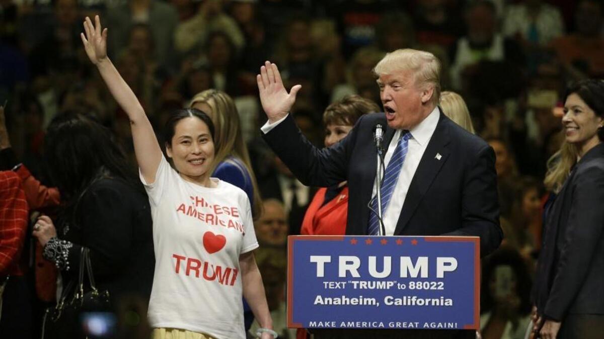 Republican presidential candidate Donald Trump greets with a group of women during a rally at the Anaheim Convention Center in California Wednesday. With his primary win in Washington behind him, Trump now moves on to five states, including California, with June 7 primaries.