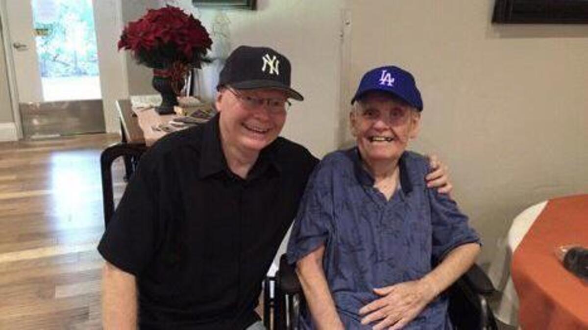 Bill Barker (left) and brother Robert show their baseball allegiances. This was their last photo together before Robert’s death in 2017.