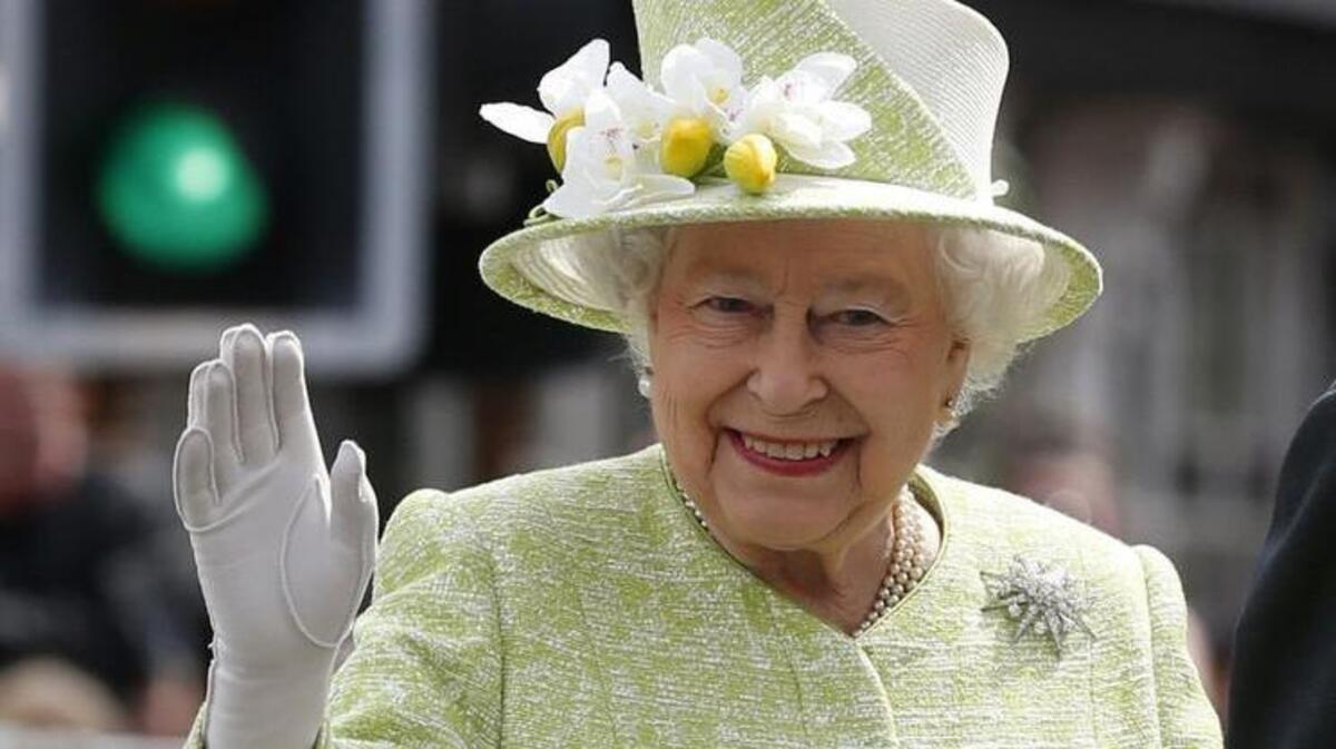 Britain's Queen Elizabeth II gives an elegant white-gloved Five Spot salute on the occasion of her 90th birthday in 2016. Somehow we doubt she’ll be attending the Seahawks game in London next fall.