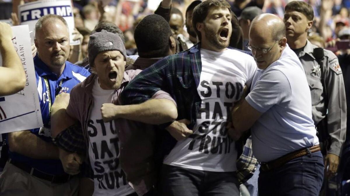 Protesters are removed as Republican presidential candidate Donald Trump speaks March 9 during a campaign rally in Fayetteville, North Carolina.