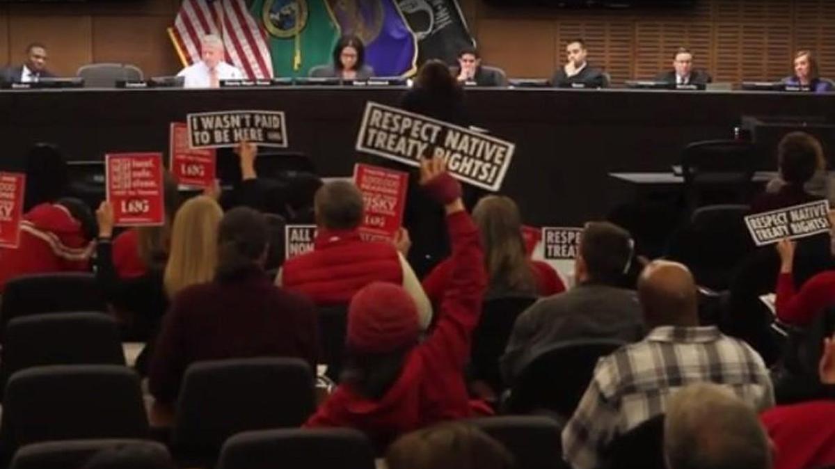 Opponents of Puget Sound Energy's proposed Port of Tacoma liquefied natural gas plant make their feelings known at the Citizens Forum before the Tacoma City Council last March.
