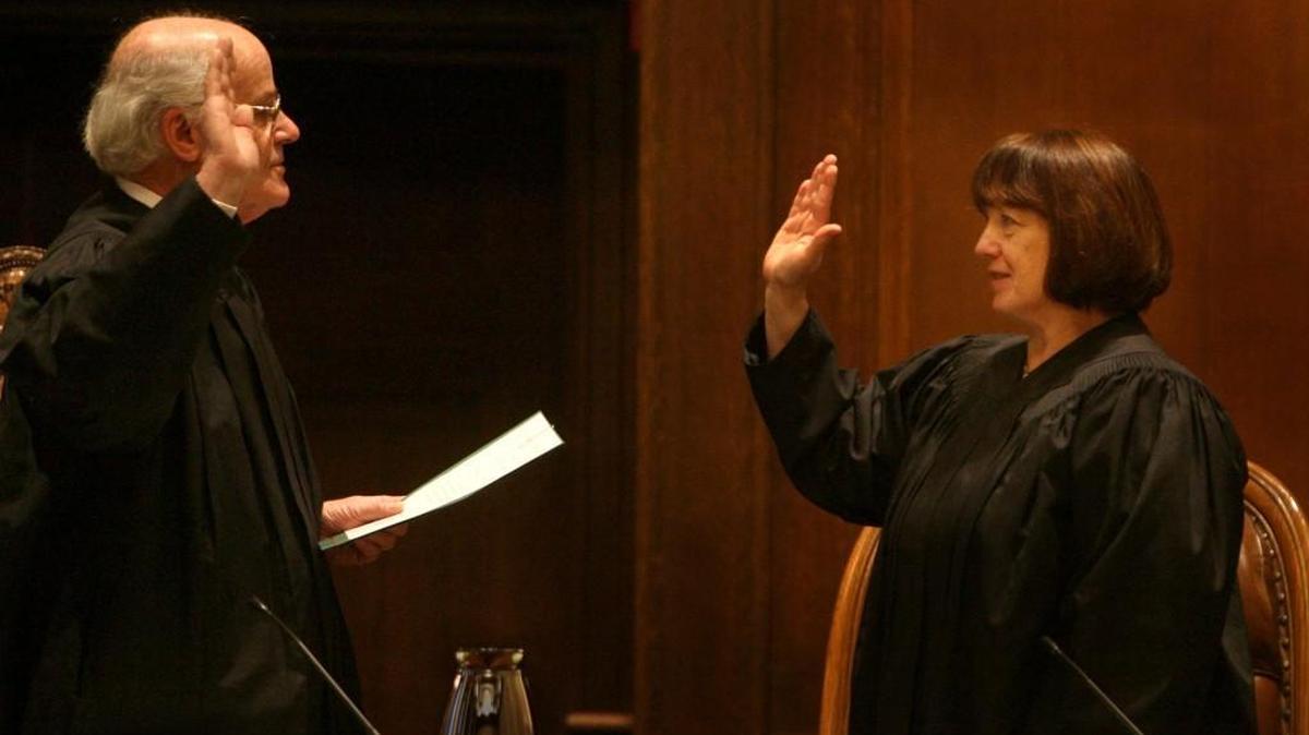 Outgoing Washington state Chief Justice Gerry L. Alexander swears in Justice Barbara A. Madsen as his replacement in 2010. Madsen is up for reelection this year, and her challenger has won big money from charter school supporters.