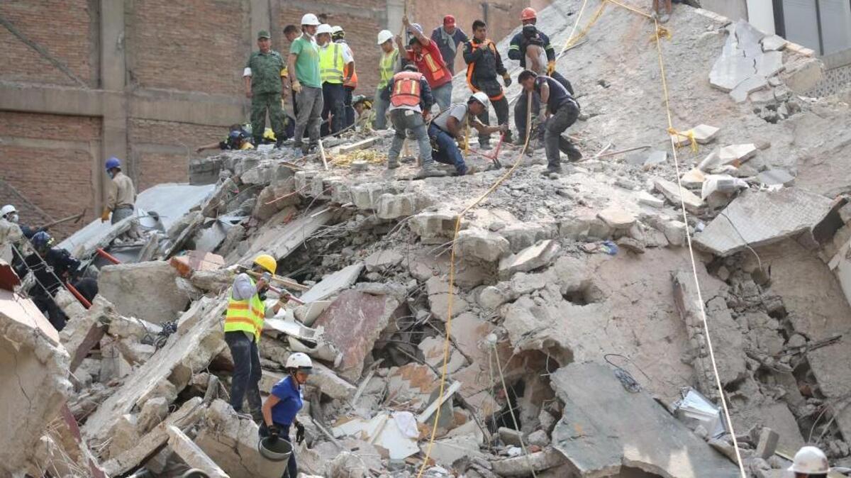 First responders work on removing the rubble of a collapsed building looking for survivors trapped underneath, after a 7.1 earthquake in Mexico City, Tuesday, Sept. 19, 2017.