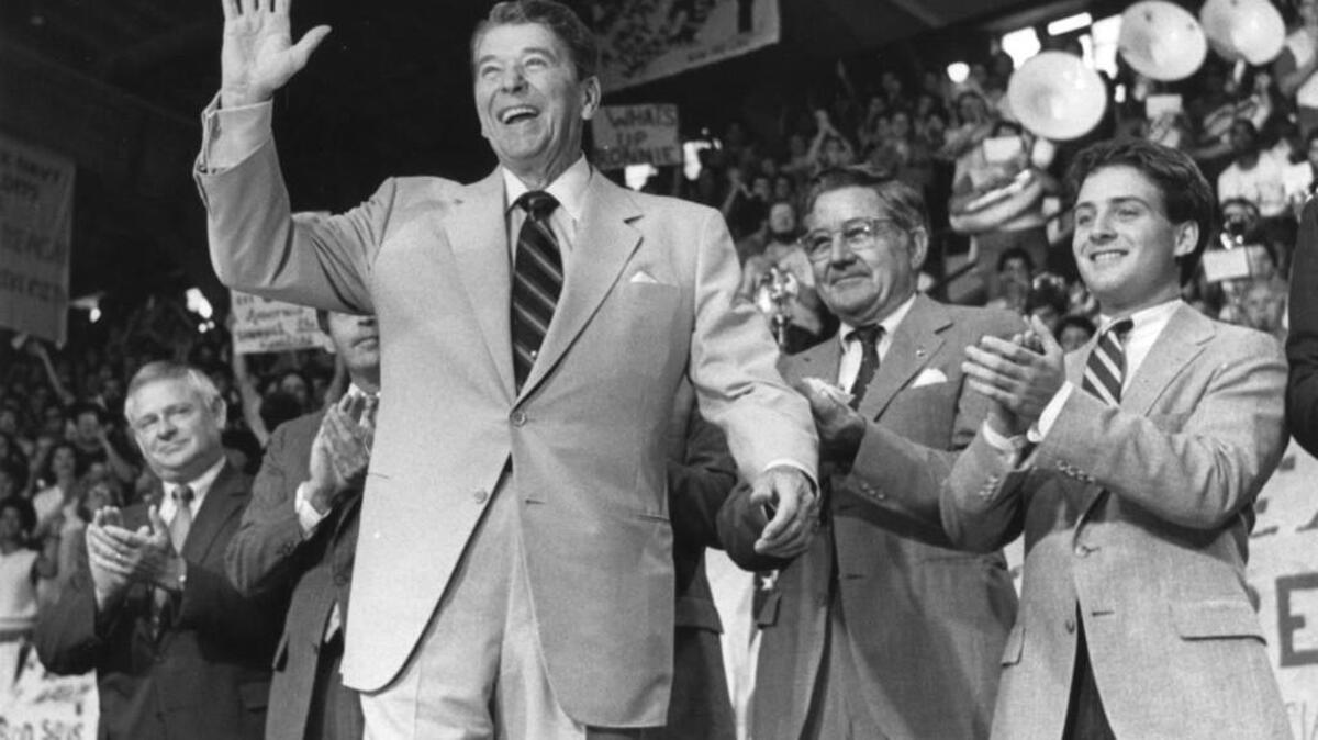 President Ronald Reagan, giving what is known today as the Five Spot salute, acknowledges a crowd in Raleigh, North Carolina, in 1985. A year earlier, while cruising to reelection, Reagan visited the Port of Tacoma.