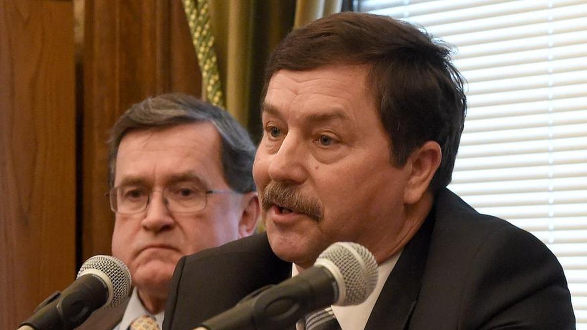 Sen. Mark Schoesler (right) takes media questions before the 2017 legislative session in Olympia.