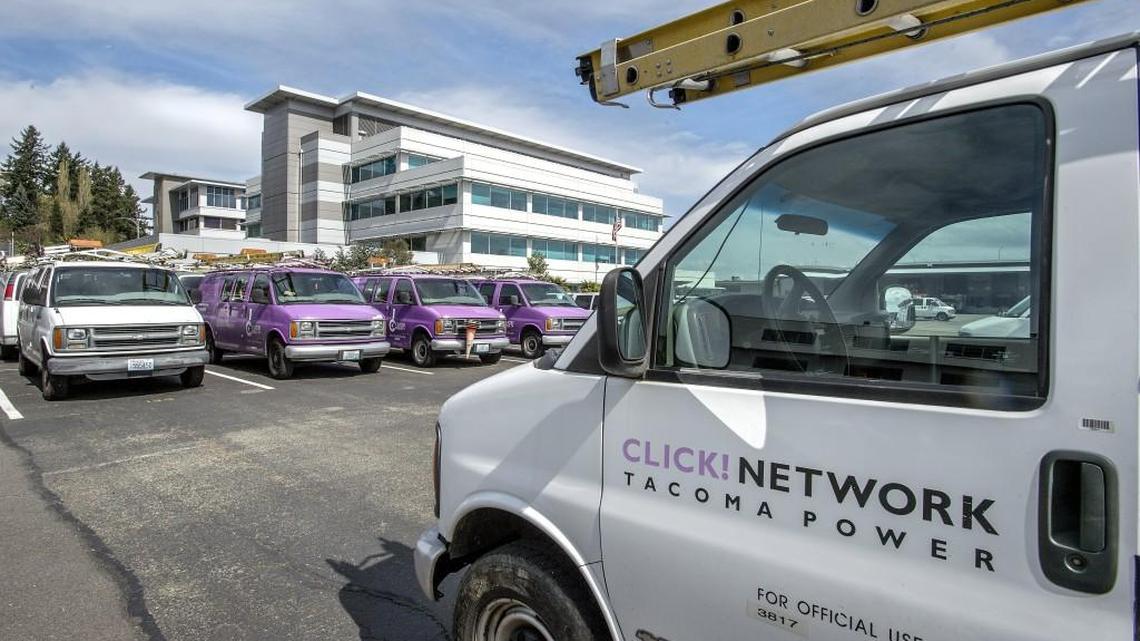Click Network vans parked at the offices of Tacoma Public Utilities.