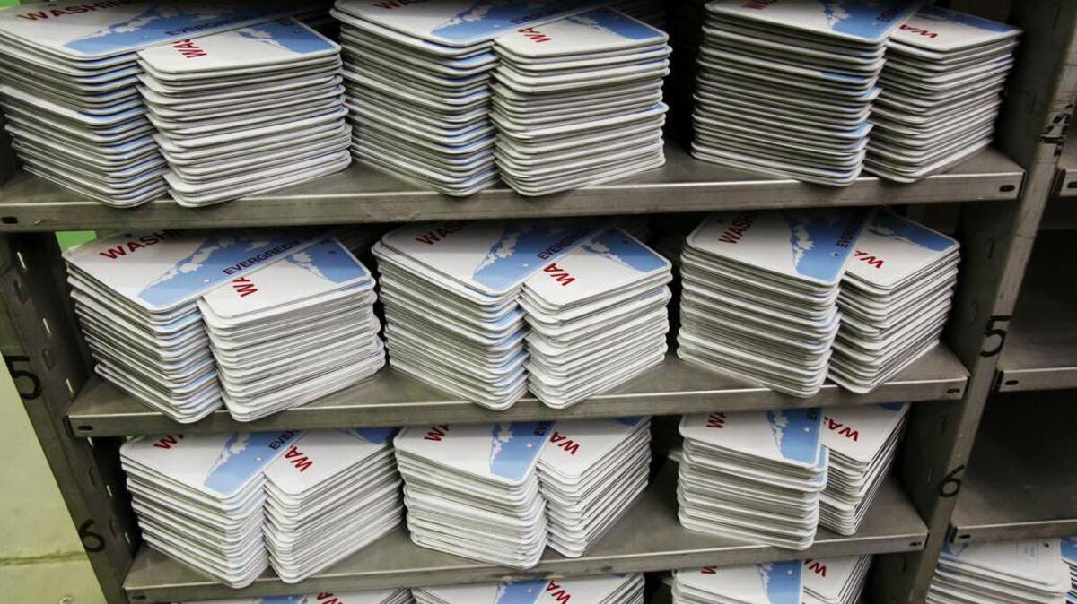 Freshly minted license plates are stacked, waiting to be embossed with numbers at the state penitentiary in Walla Walla. All of Washington’s license plates are made by state prison inmates.