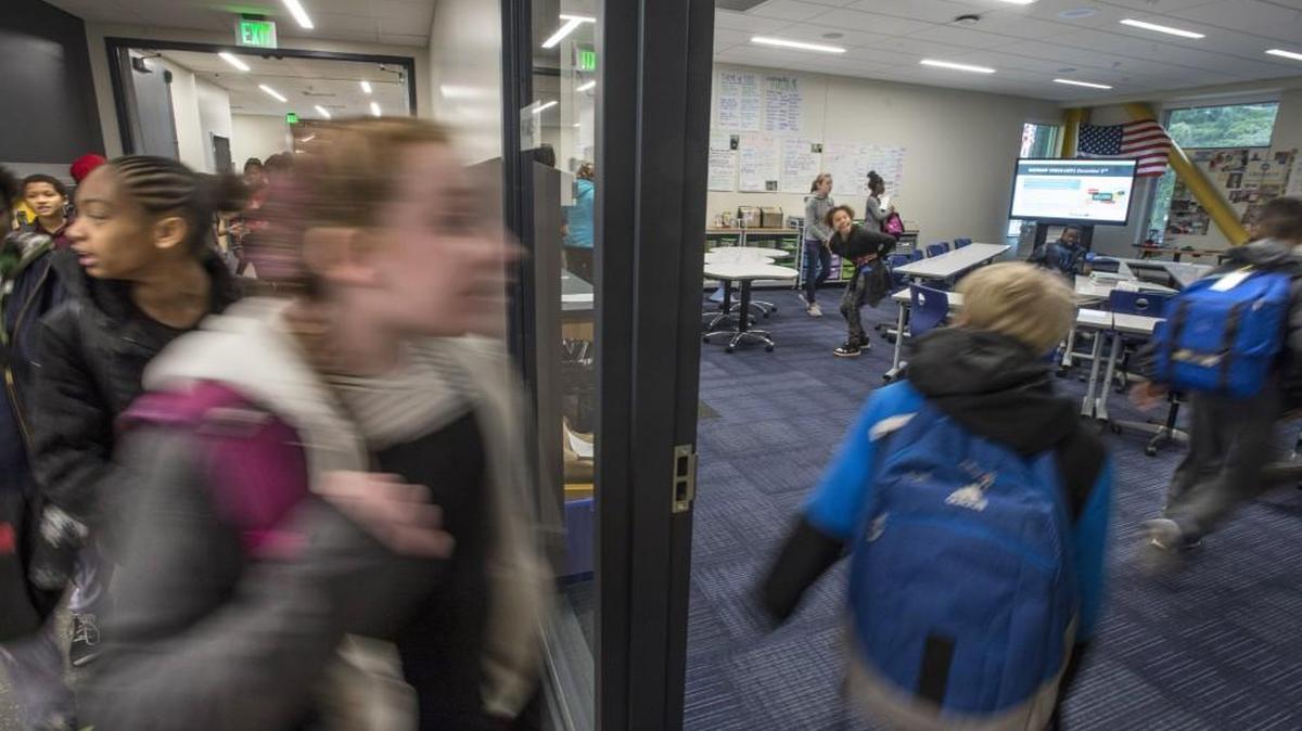 Students enter a classroom at Wainwright Intermediate School in the Tacoma school district.