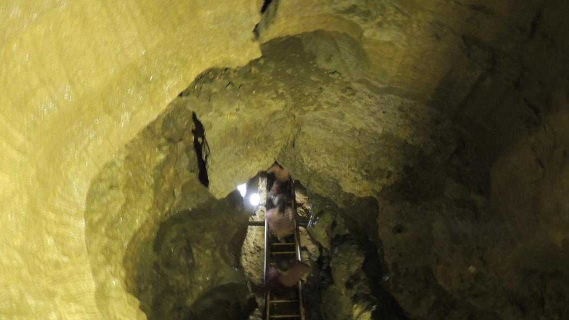 
Visitors make their way down 280 stairs as they descend a large vertical shaft at the start of the Domes and Dripstones tour of Mammoth Cave at Mammoth Cave National Park.
