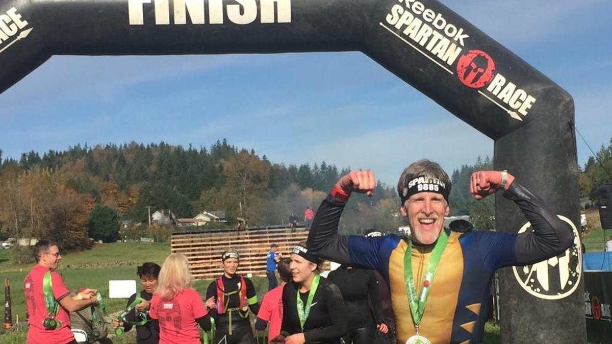 Todd Steben of Olympia celebrates after his winning his age group at the Seattle Spartan Beast Race in October. He won his age group in four obstacle-course races in 2016.