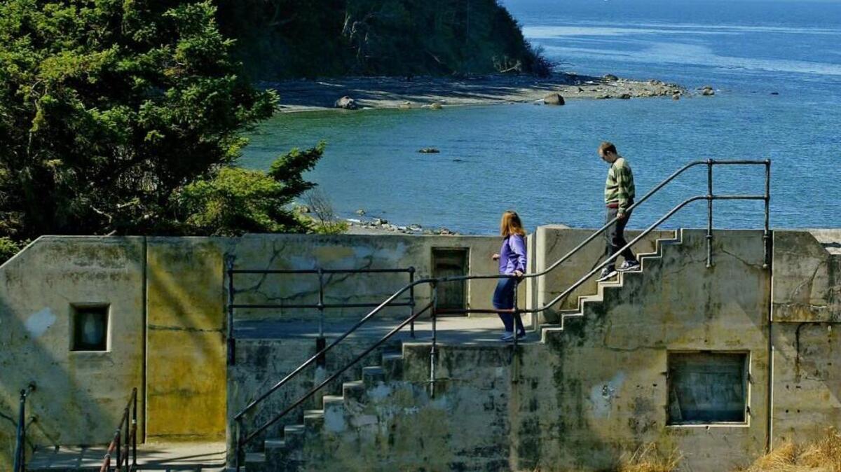 Jenny Springer and Jeff Beesler explore the remains of Battery Kinzie at Fort Worden State Park in Port Townsend. The fort was a film location for “An Officer and a Gentleman.”