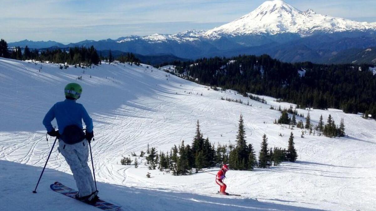Rachel Emmons of Yakima watches Nora Emmons as she skied the Snow Devil run, 6,500 feet above sea level at White Pass.