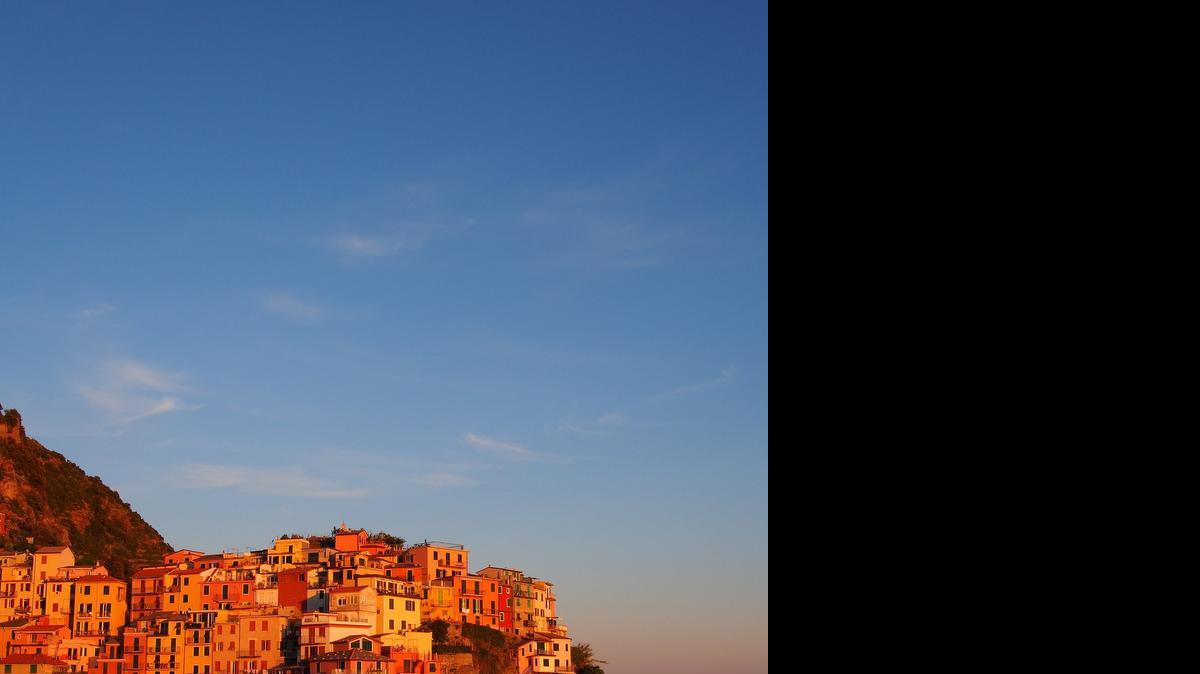 
The village of Manarola, Italy glows in the light as the sun sets in May 2015. It is one of five villages, just miles apart, that sit along the Mediterranean coast in Northern Italy.
