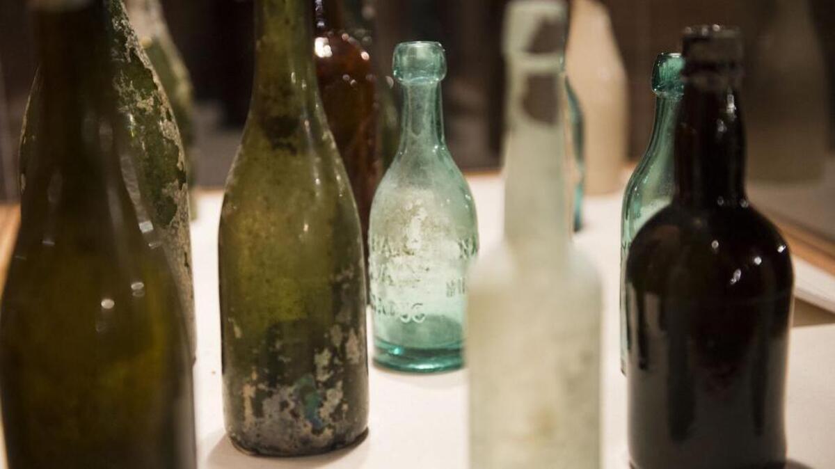 
Old saloon bottles found in the ground are displayed in a case as visitors learn about Sacramento history  on an Old Sacramento Underground Tour.
