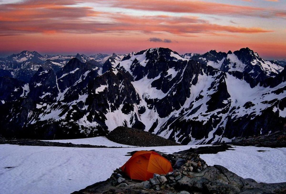 An array of peaks and glaciers remind climbers of the Alps looking south from Sahale Glacier Camp in North Cascades National Park.