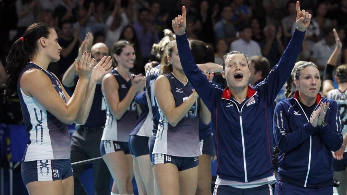 United States’ Courtney Thompson, second from right, celebrates with teammates after defeating Brazil during a semifinal volleyball match, at the women’s Volleyball World Championships in Milan, Italy, in 2014.