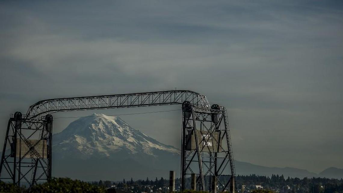 A geologic dip just west (to the right) of Mount Rainier which soon could be named “Vancouver Notch” could be seen from Tacoma’s Fireman’s Park on Thursday, Oct. 15, 2015. The Murray Morgan Bridge (11th Street Bridge) is in the foreground.