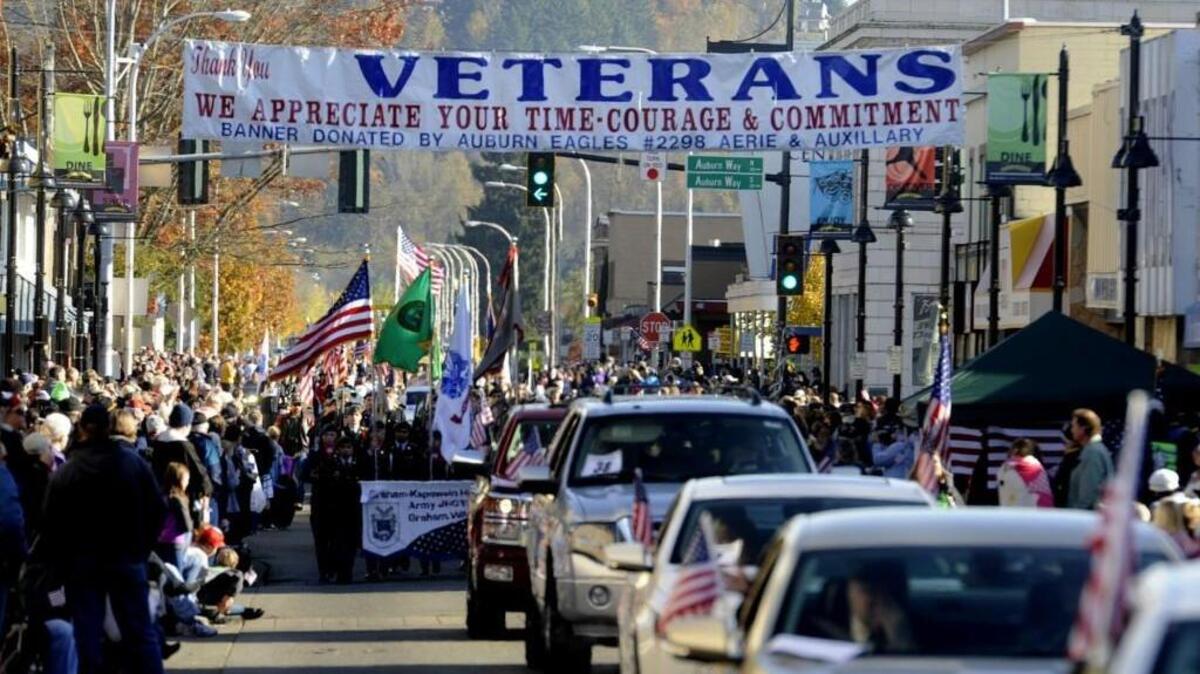 
The Auburn Veterans Parade rolls underneath a welcome banner during the 49th annual Veterans Day Parade in 2014. This year’s parade will be Nov. 7.
