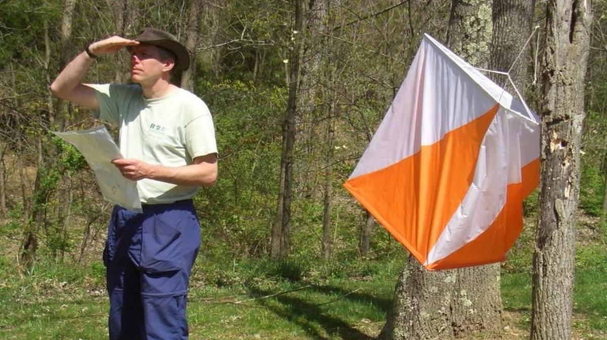 Bob Forgrave, president of the Cascade Orienteering Club, monitors a checkpoint.