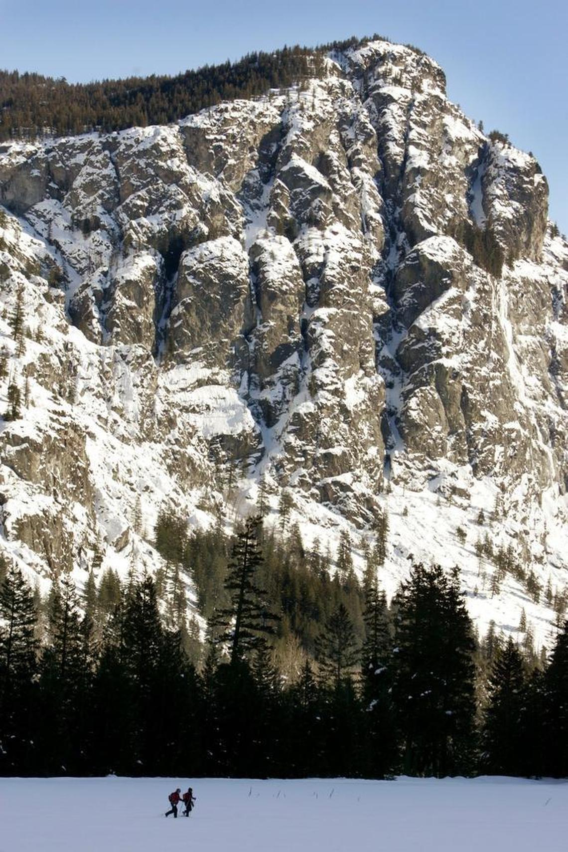 Cross-country skiers make their way across an open meadow at the west end of Jack’s Trail on the Mazama ski trails in the Methow Valley.