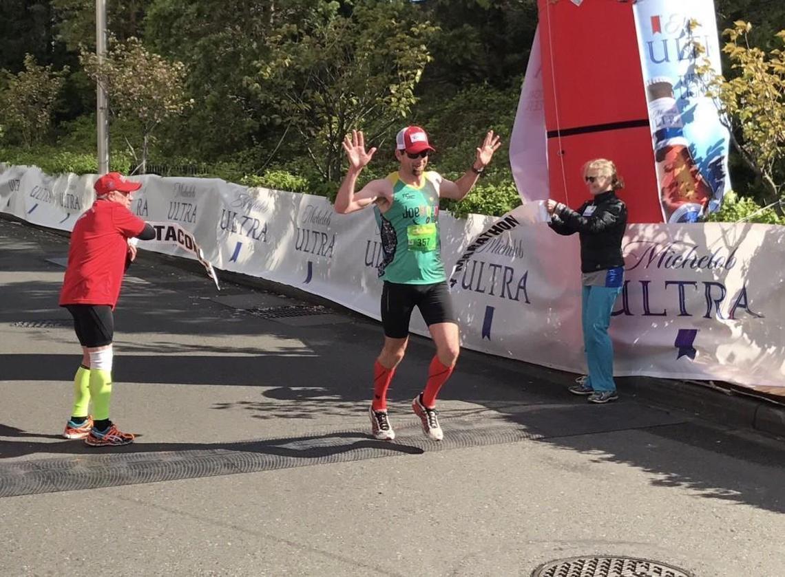 Ben Mangrum of Tacoma crosses the finish line Sunday at the Tacoma City Marathon in 2017.