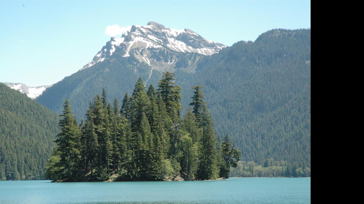 
Packwood Lake with Agnes Island in the foreground and Johnson Peak in the Goat Rocks Wilderness in background. The U.S. Forest Service prohibits access to Agnes Island.
