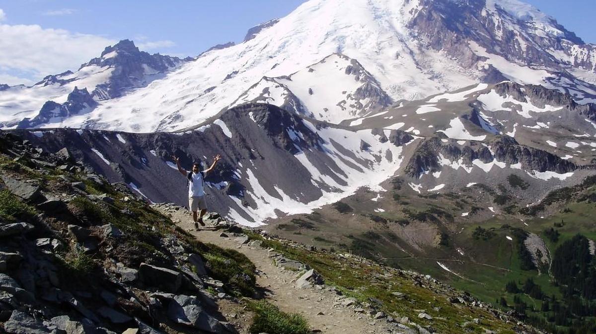 Robert Portello takes in the beauty of Mount Rainier while hiking to the Fremont Lookout during his first visit to the national park. The trail to the lookout will be accessible Friday when the road to Sunrise opens.