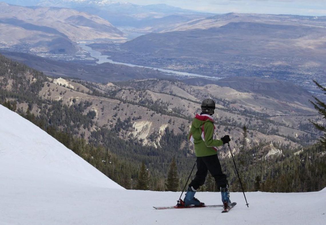 A young skier takes in the view of Wentachee and the Columbia River from Mission Ridge.