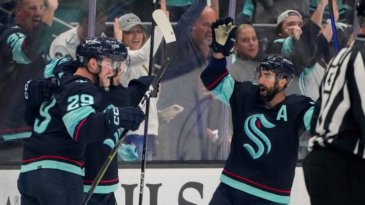 Seattle Kraken defenseman Vince Dunn (29) and right wing Jordan Eberle, right, celebrate a goal by left wing Tye Kartye, center, against the Dallas Stars during the second period of Game 6 of an NHL hockey Stanley Cup second-round playoff series Saturday, May 13, 2023, in Seattle. (AP Photo/Lindsey Wasson)